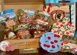 Cherry Republic gift basket with decorative cutting board, playe and towel